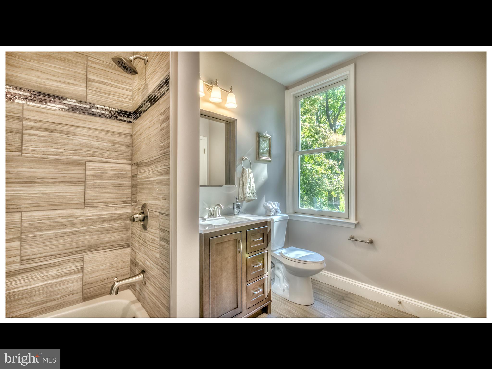 4519 Keswick Road Baltimore, MD 21210 - Photo 17 of 29 a view of bathroom with a sink and a toilet
