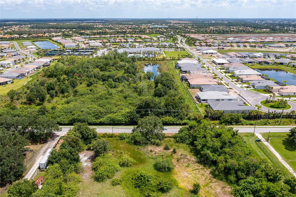 10800 Bill Tucker Road Wimauma, FL 33598 - Photo 4 of 9 an aerial view of multiple house