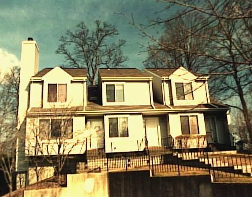2 East Pembroke Road, Unit 67 Danbury, CT 06811 - Photo 1 of 1 a front view of a residential apartment building with a yard