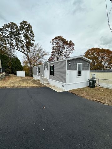 a view of a house with a snow on the road
