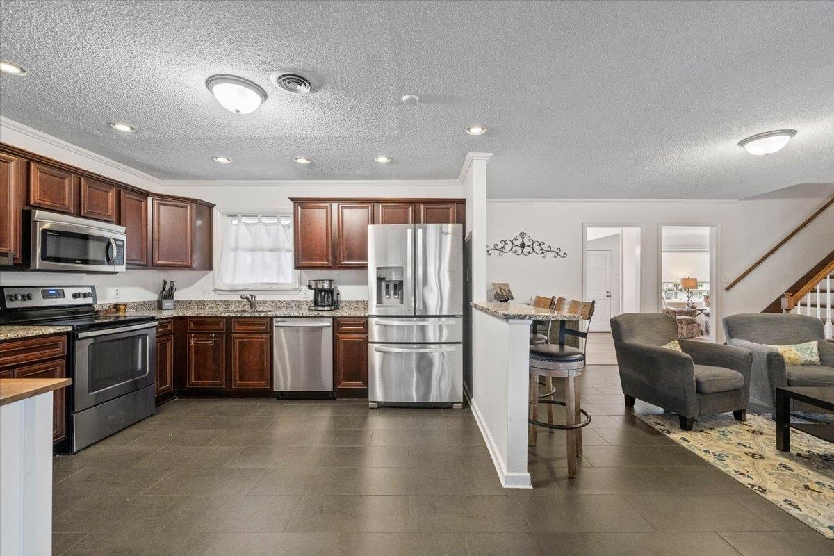 436 Cardinal Drive Collierville, TN 38017 - Photo 11 of 32 a kitchen with a sink stainless steel appliances and cabinets
