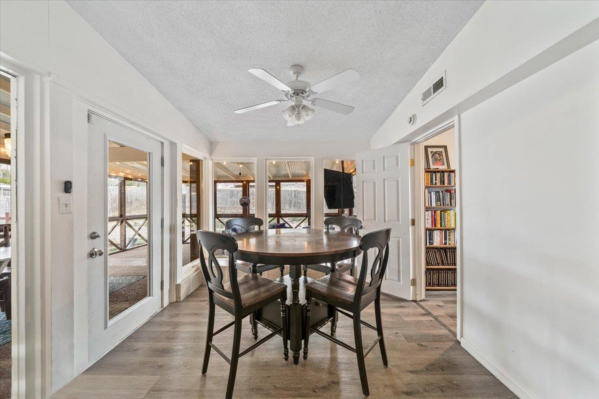 436 Cardinal Drive Collierville, TN 38017 - Photo 13 of 32 a view of a dining room with furniture and a chandelier fan