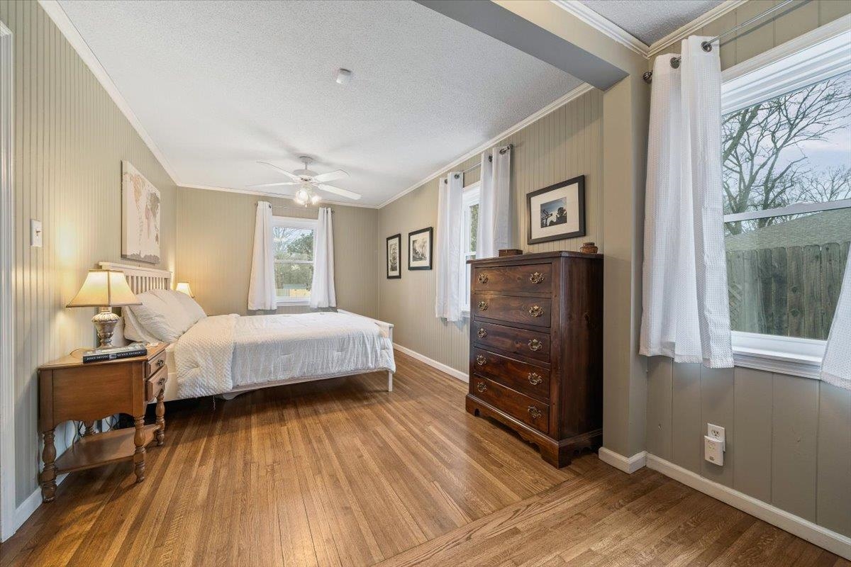 436 Cardinal Drive Collierville, TN 38017 - Photo 16 of 32 a bedroom with a bed and wooden floor