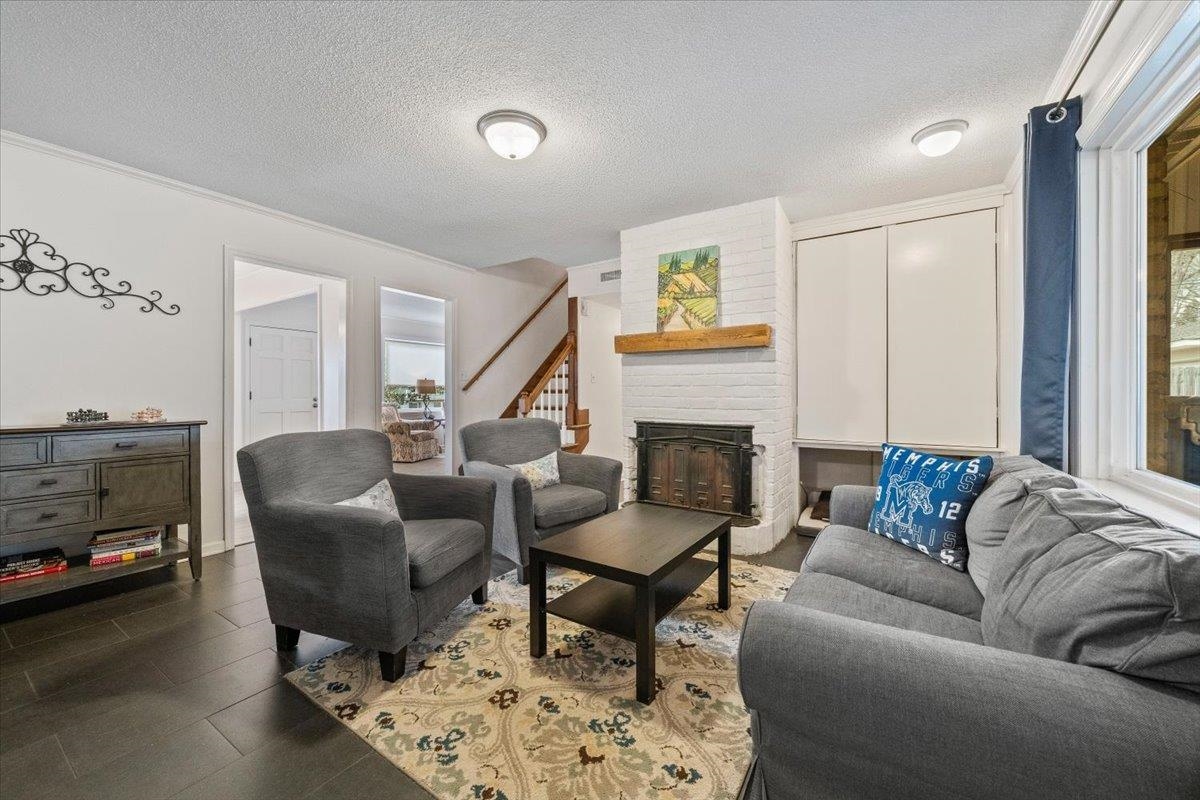 436 Cardinal Drive Collierville, TN 38017 - Photo 7 of 32 a living room with furniture and a fireplace