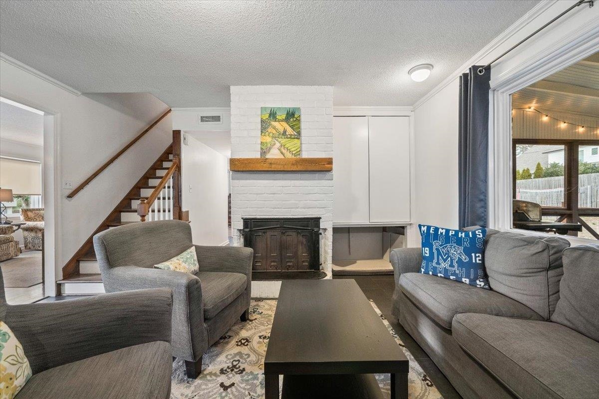 436 Cardinal Drive Collierville, TN 38017 - Photo 8 of 32 a living room with furniture and a fireplace