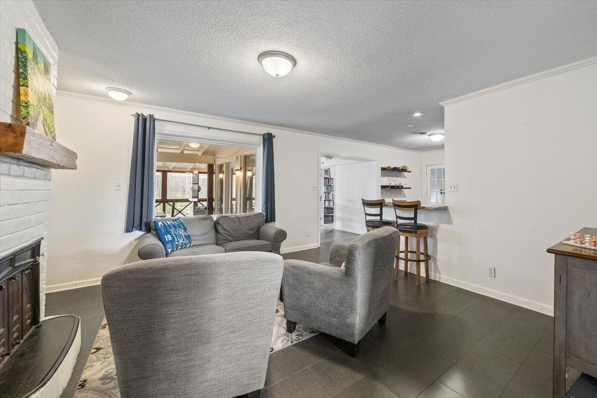436 Cardinal Drive Collierville, TN 38017 - Photo 9 of 32 a living room with fireplace furniture and a flat screen tv