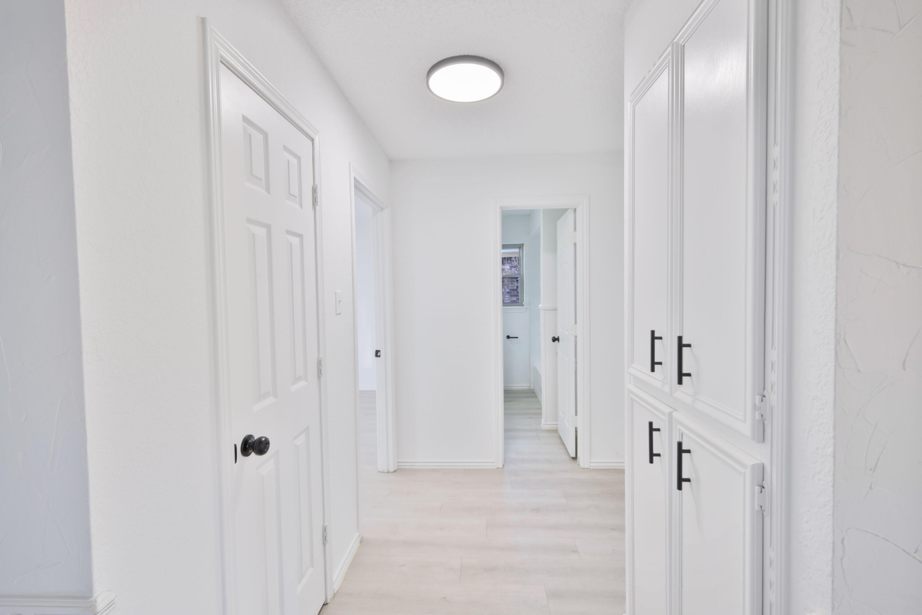 5104 73rd Street Lubbock, TX 79424 - Photo 16 of 20 a view of a hallway with wooden floor