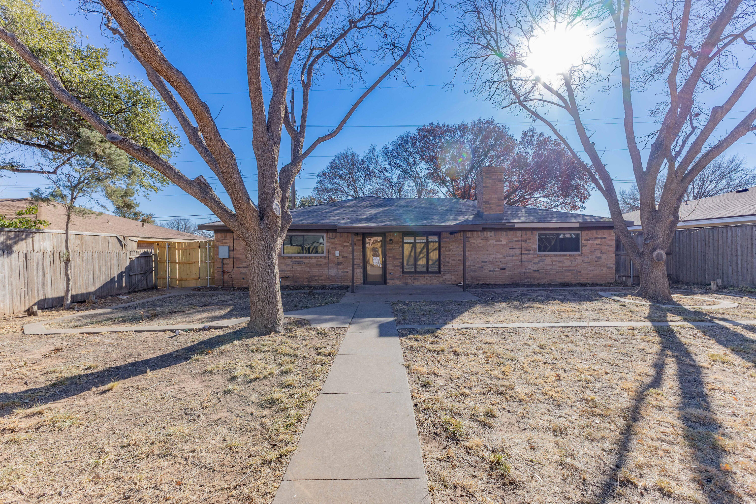 5104 73rd Street Lubbock, TX 79424 - Photo 18 of 20 a view of a yard with a tree