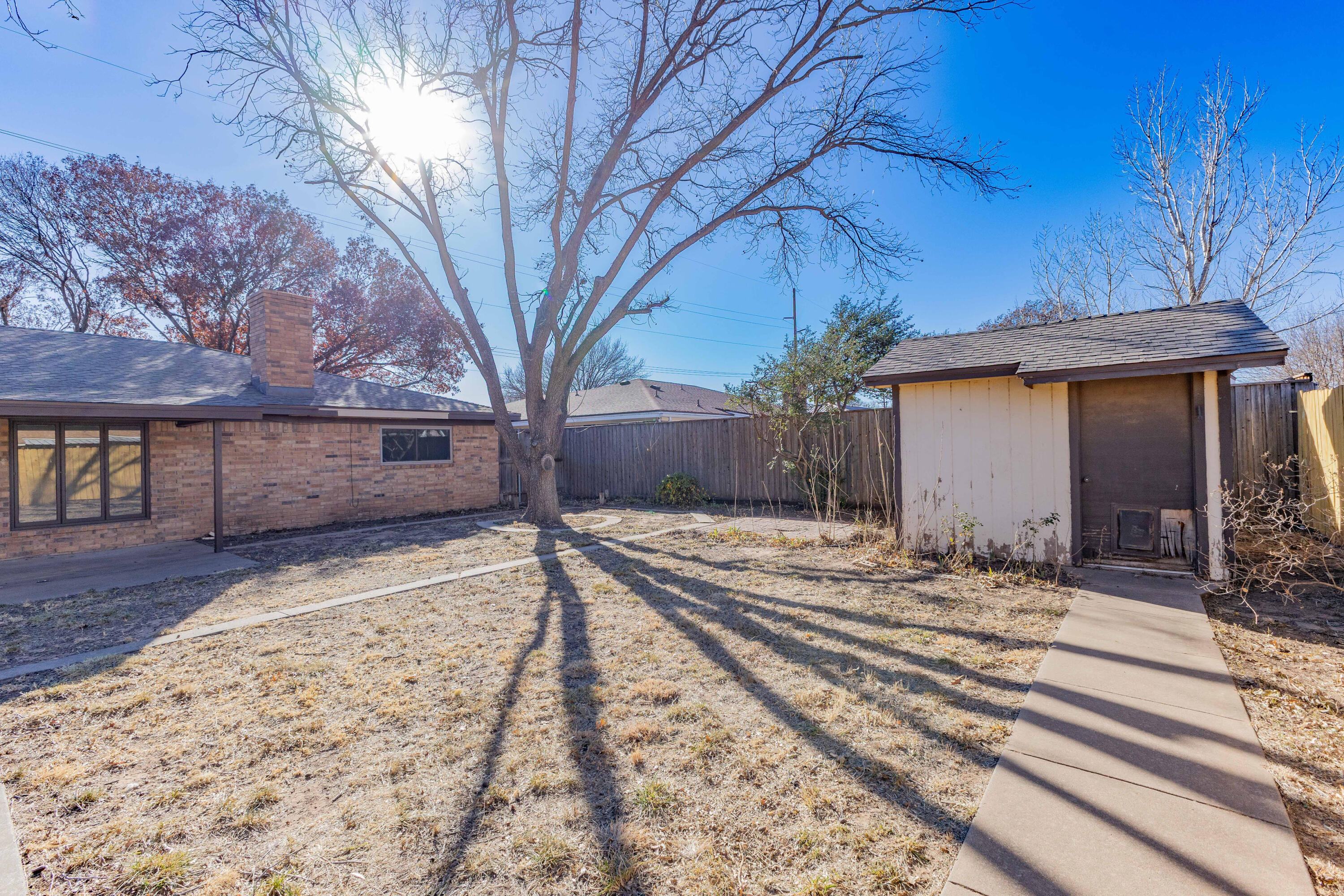 5104 73rd Street Lubbock, TX 79424 - Photo 19 of 20 a view of a backyard of the house