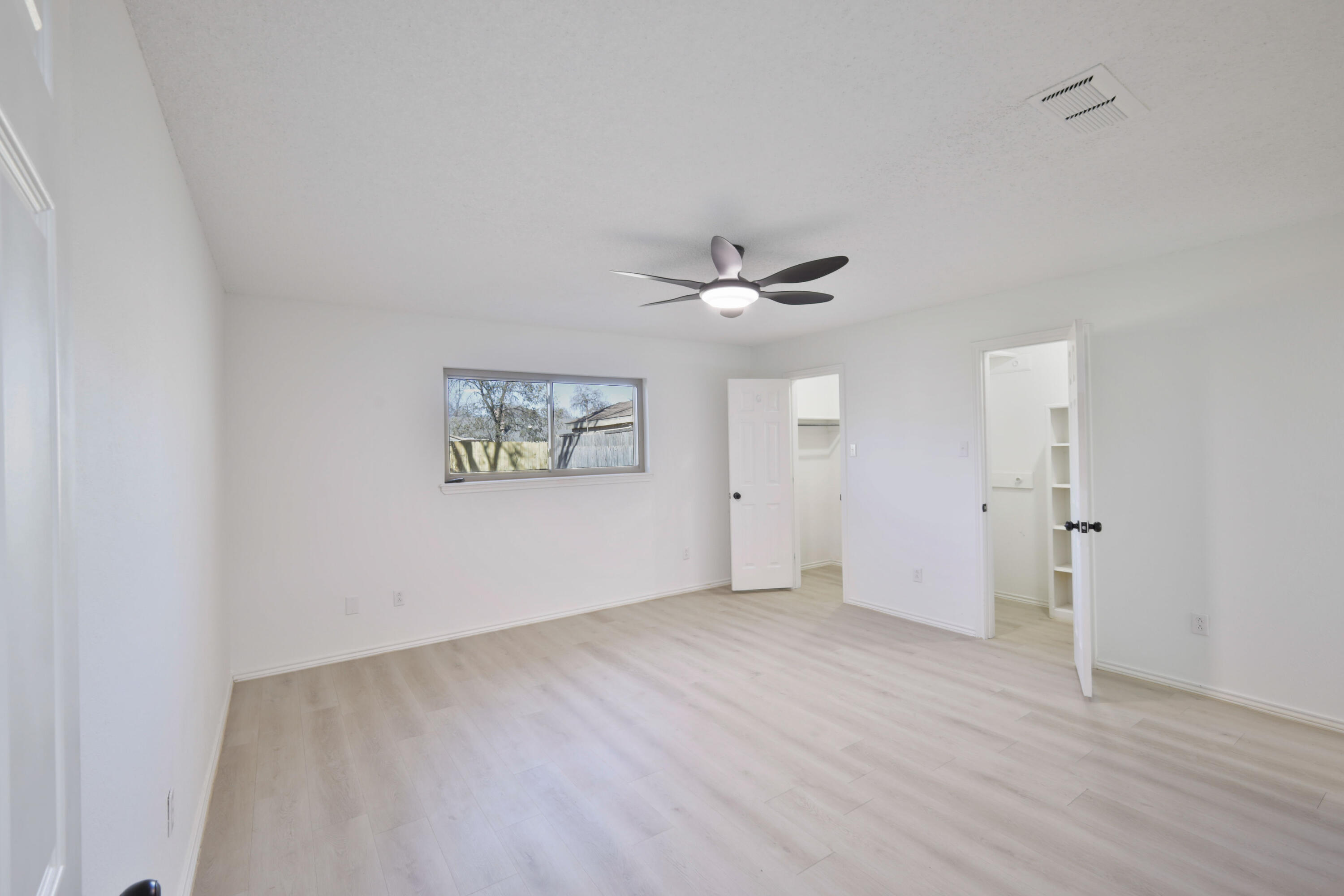 5104 73rd Street Lubbock, TX 79424 - Photo 7 of 20 wooden floor in an empty room