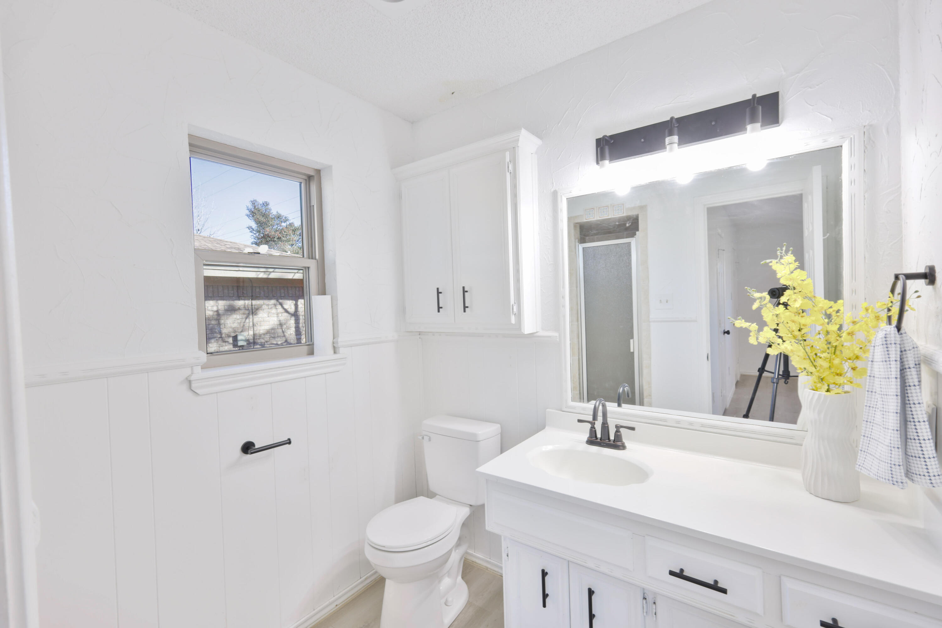 5104 73rd Street Lubbock, TX 79424 - Photo 8 of 20 a bathroom with a sink and a mirror