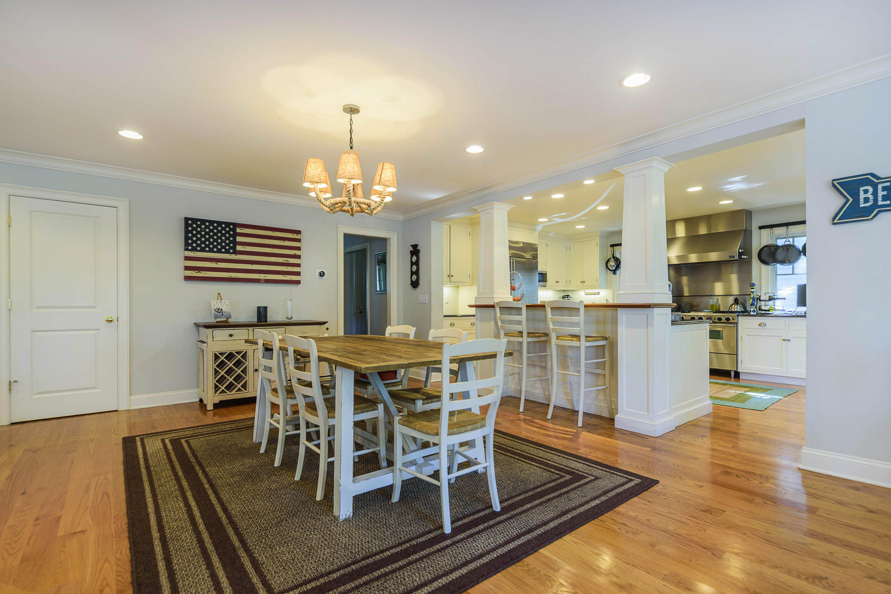41 Pine Point Road Rowayton, CT 06853 - Photo 4 of 27 a view of a dining room with furniture a chandelier and wooden floor