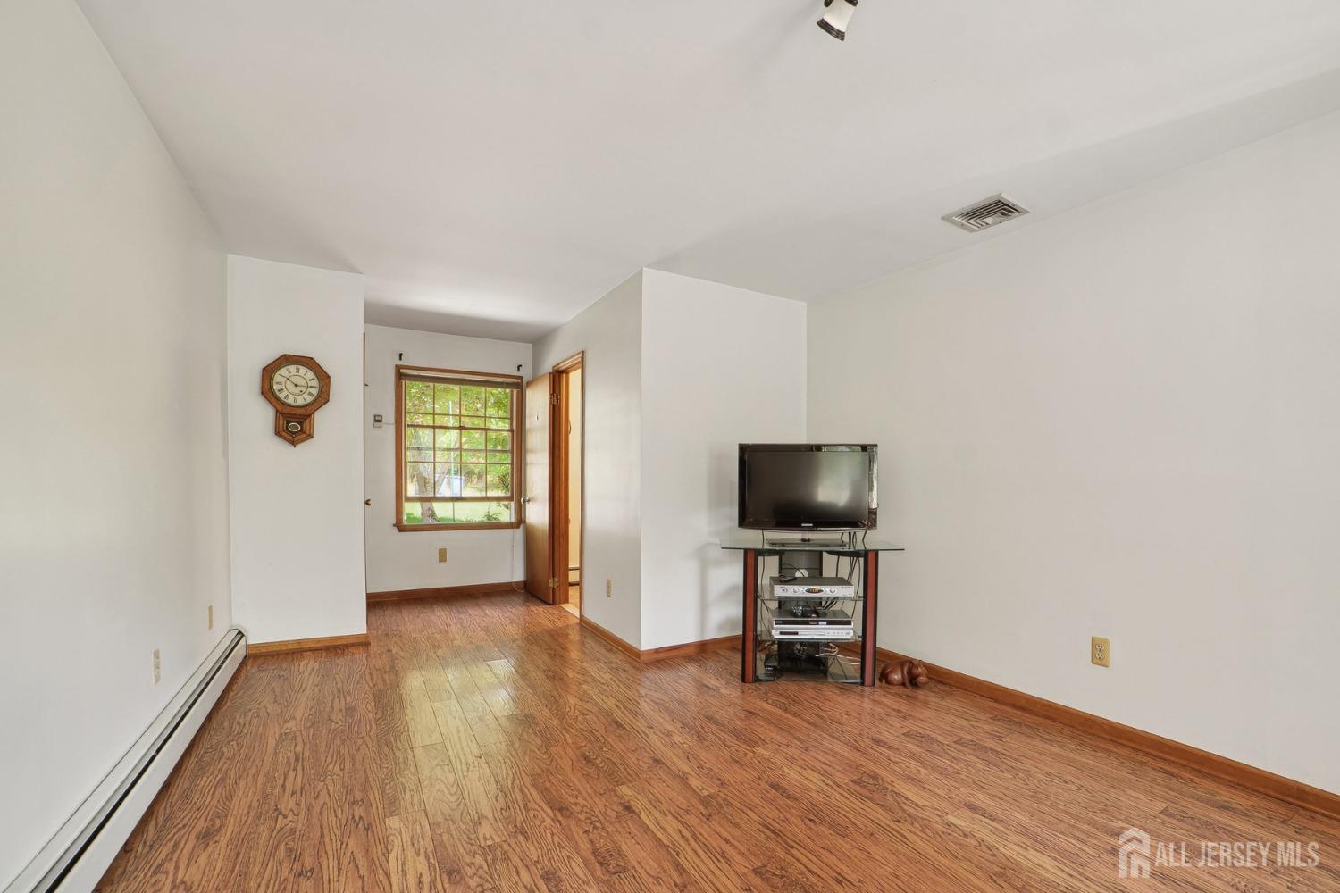 442 Garretson Road Bridgewater, NJ 08807 - Photo 13 of 29 a view of a livingroom with a flat screen tv and a window
