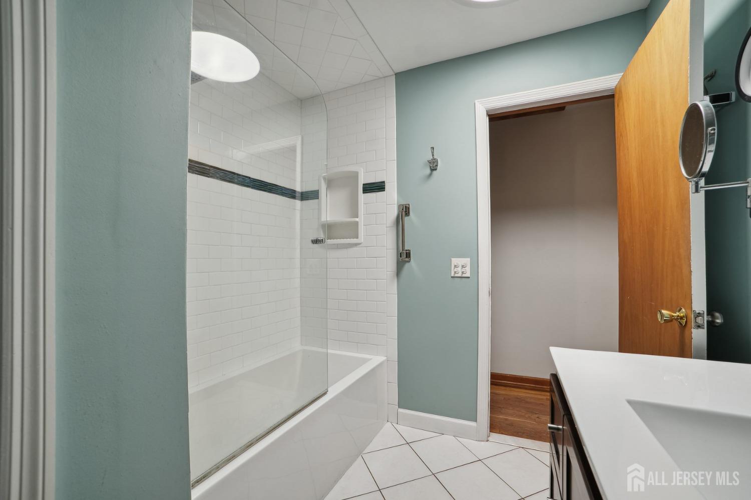 442 Garretson Road Bridgewater, NJ 08807 - Photo 15 of 29 a bathroom with a bathtub and a shower