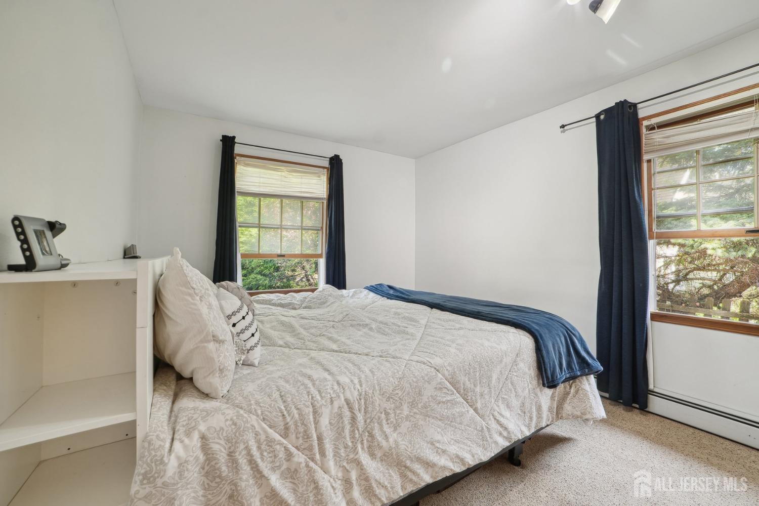 442 Garretson Road Bridgewater, NJ 08807 - Photo 17 of 29 a large bed sitting in a bedroom next to a window