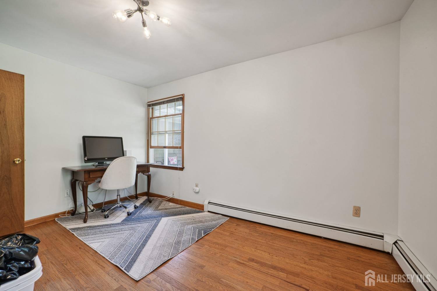 442 Garretson Road Bridgewater, NJ 08807 - Photo 20 of 29 a workspace with furniture and a window
