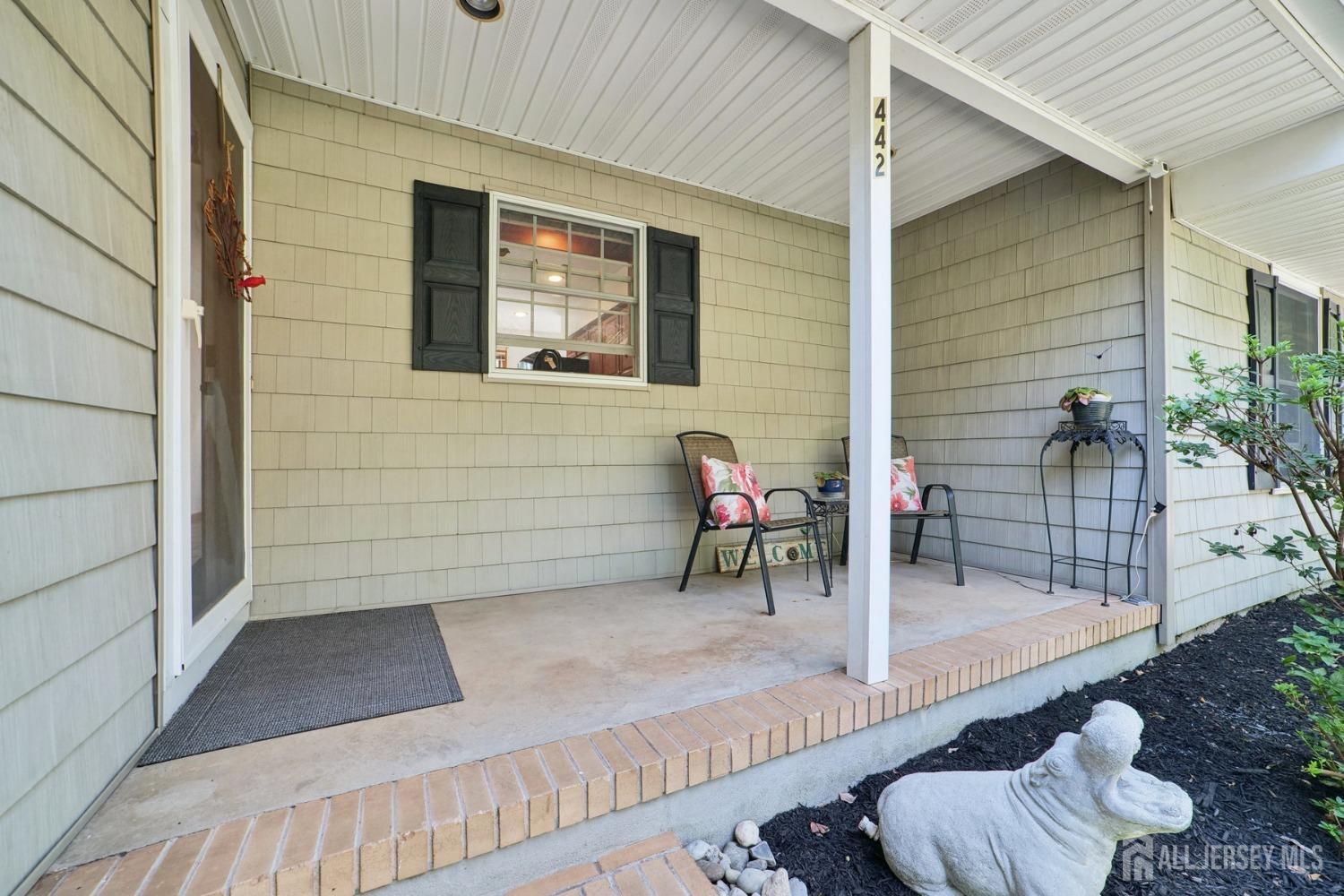 442 Garretson Road Bridgewater, NJ 08807 - Photo 2 of 29 a view of a deck with chair and table