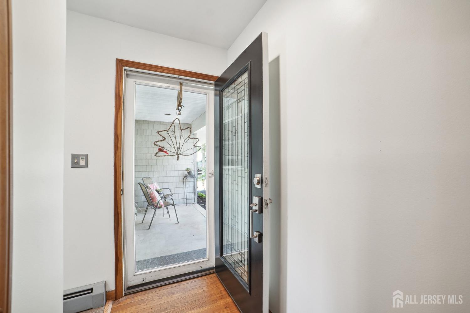 442 Garretson Road Bridgewater, NJ 08807 - Photo 3 of 29 a view of a glass door and a living room