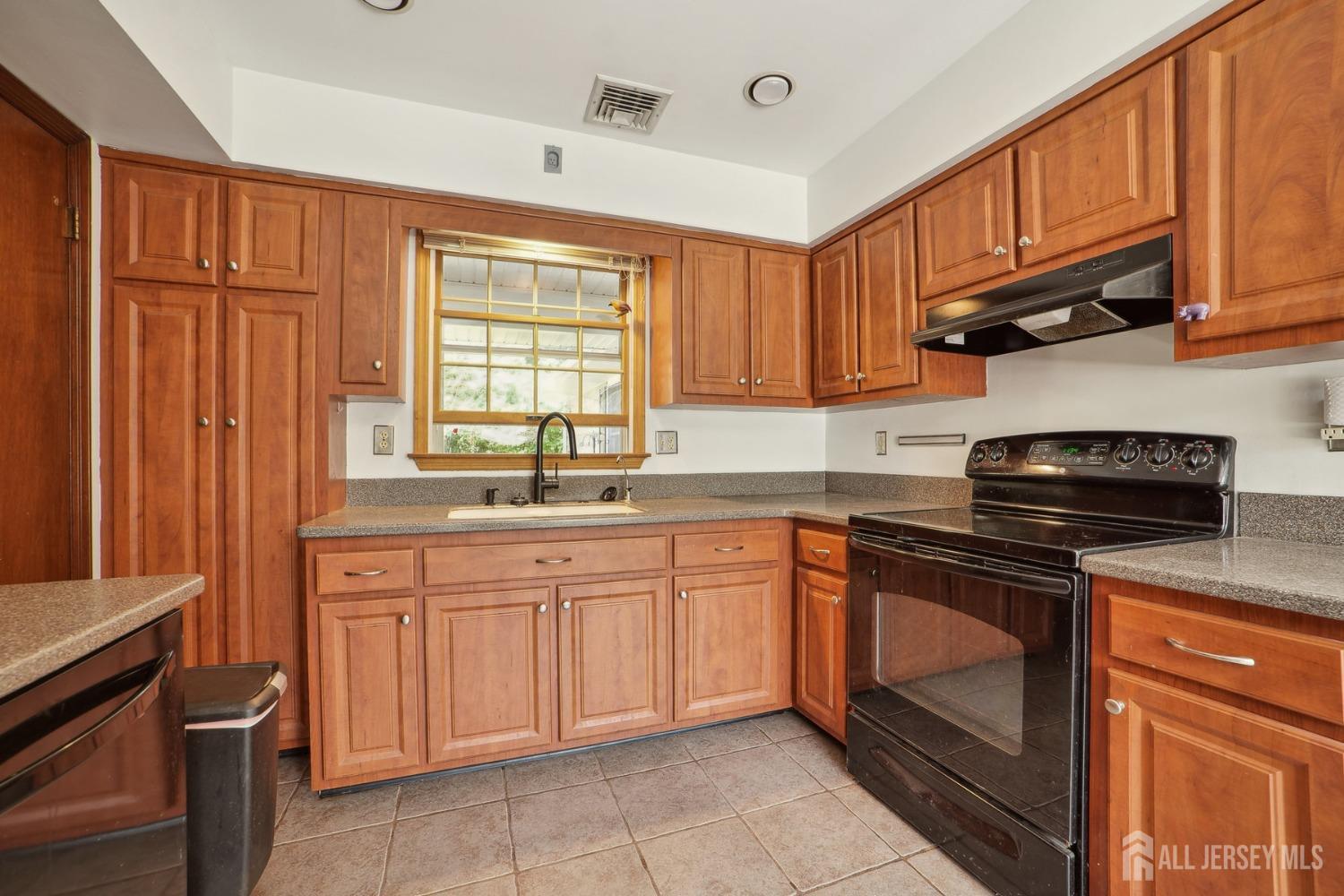 442 Garretson Road Bridgewater, NJ 08807 - Photo 8 of 29 a kitchen with stainless steel appliances granite countertop a stove sink and cabinets
