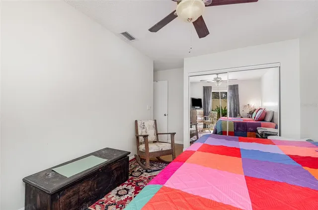 a bed room with a bed and furniture