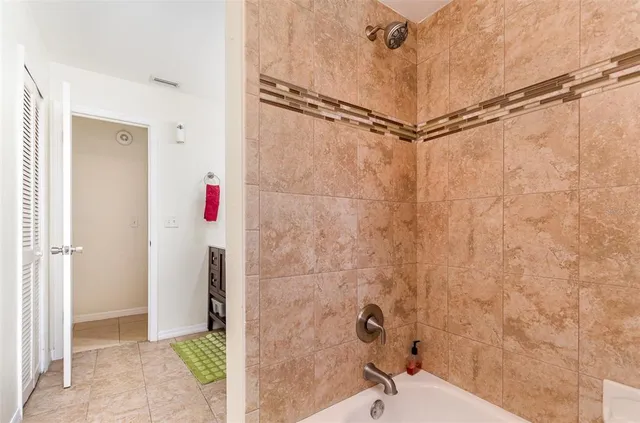 a bathroom with a shower and a shower