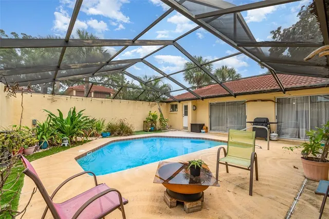 a view of a swimming pool with a patio