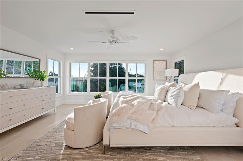 1984 Frederick Street Naples, FL 34112 - Photo 17 of 38 a spacious bedroom with a bed and a window