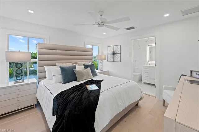 a bed room with a bed and a window