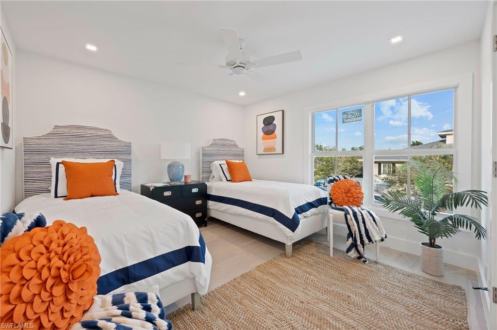 1984 Frederick Street Naples, FL 34112 - Photo 26 of 38 a bedroom with two beds and a potted plant