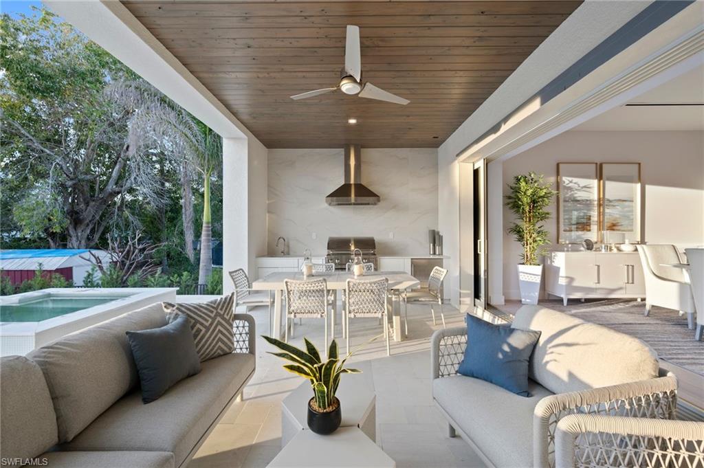 1984 Frederick Street Naples, FL 34112 - Photo 32 of 38 a view of an outdoor dining space with furniture