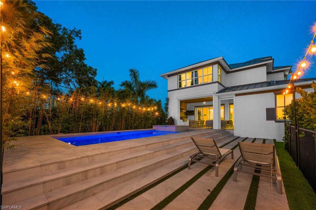1984 Frederick Street Naples, FL 34112 - Photo 35 of 38 a view of swimming pool with red chairs