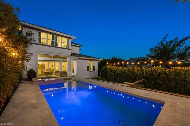 a view of a house with swimming pool