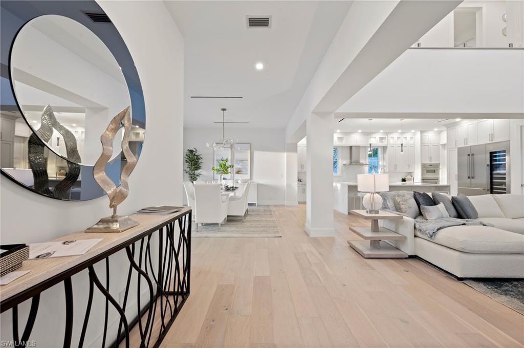 1984 Frederick Street Naples, FL 34112 - Photo 6 of 38 a living room with furniture and a mirror