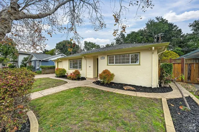 front view of a house with a yard