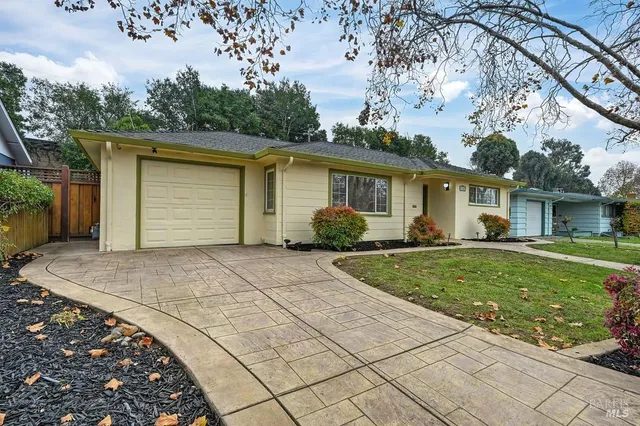 a view of a house with a backyard