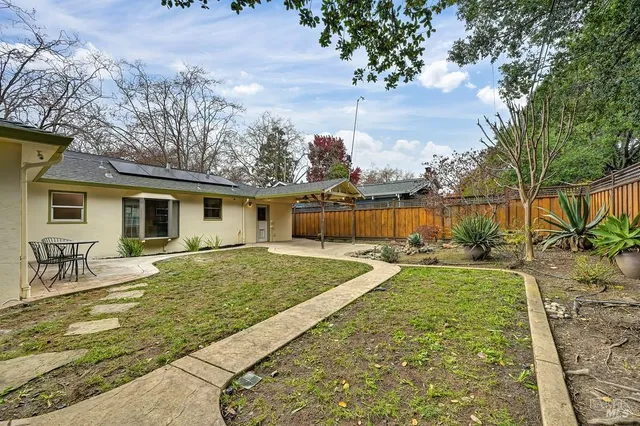 a view of a balcony with a tree