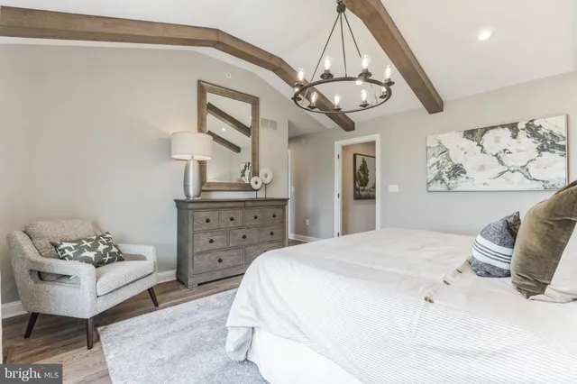 a bedroom with a bed and ceiling fan