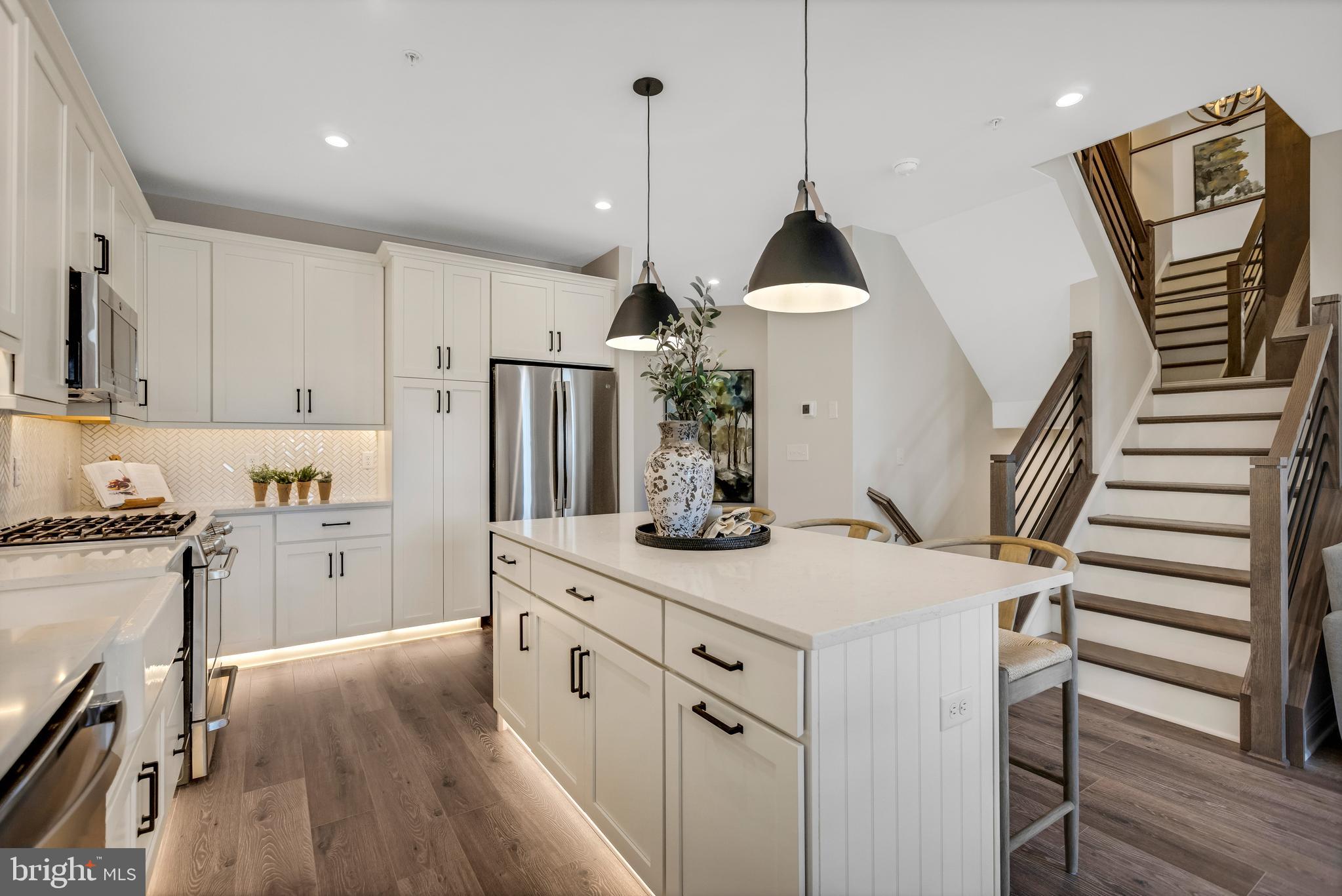 3 Baldwin Way Perkasie, PA 18944 - Photo 8 of 44 a kitchen with white cabinets and stainless steel appliances