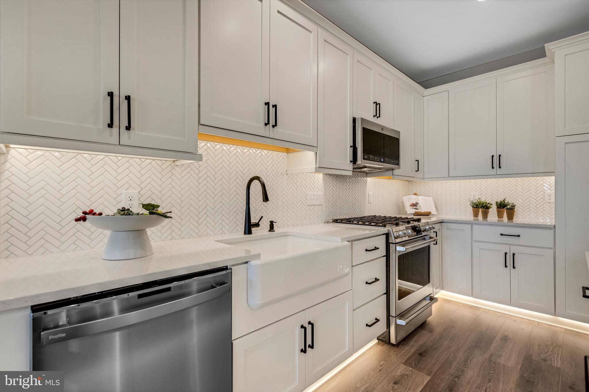 3 Baldwin Way Perkasie, PA 18944 - Photo 10 of 44 a kitchen with white cabinets and stainless steel appliances