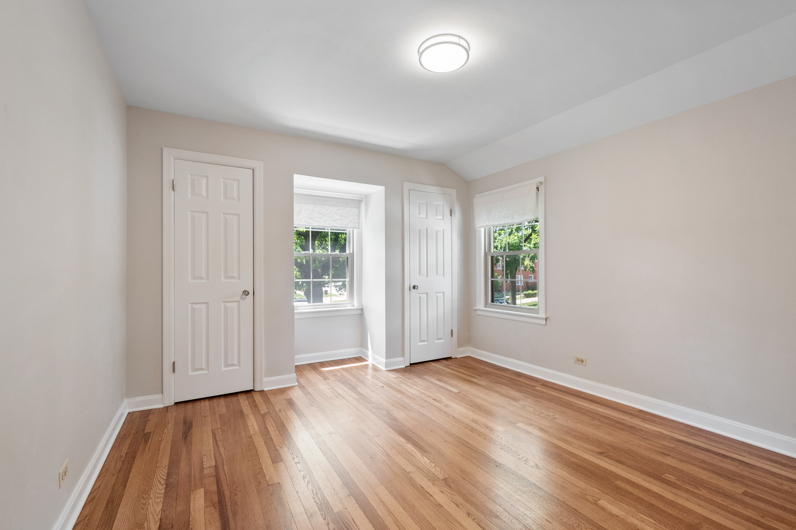 103 North Home Avenue Park Ridge, IL 60068 - Photo 16 of 28 an empty room with wooden floor and windows