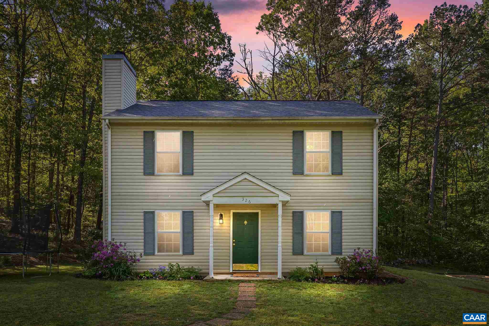 326 Geranium Road Ruckersville, VA 22968 - Photo 1 of 48 a front view of a house with a yard and trees