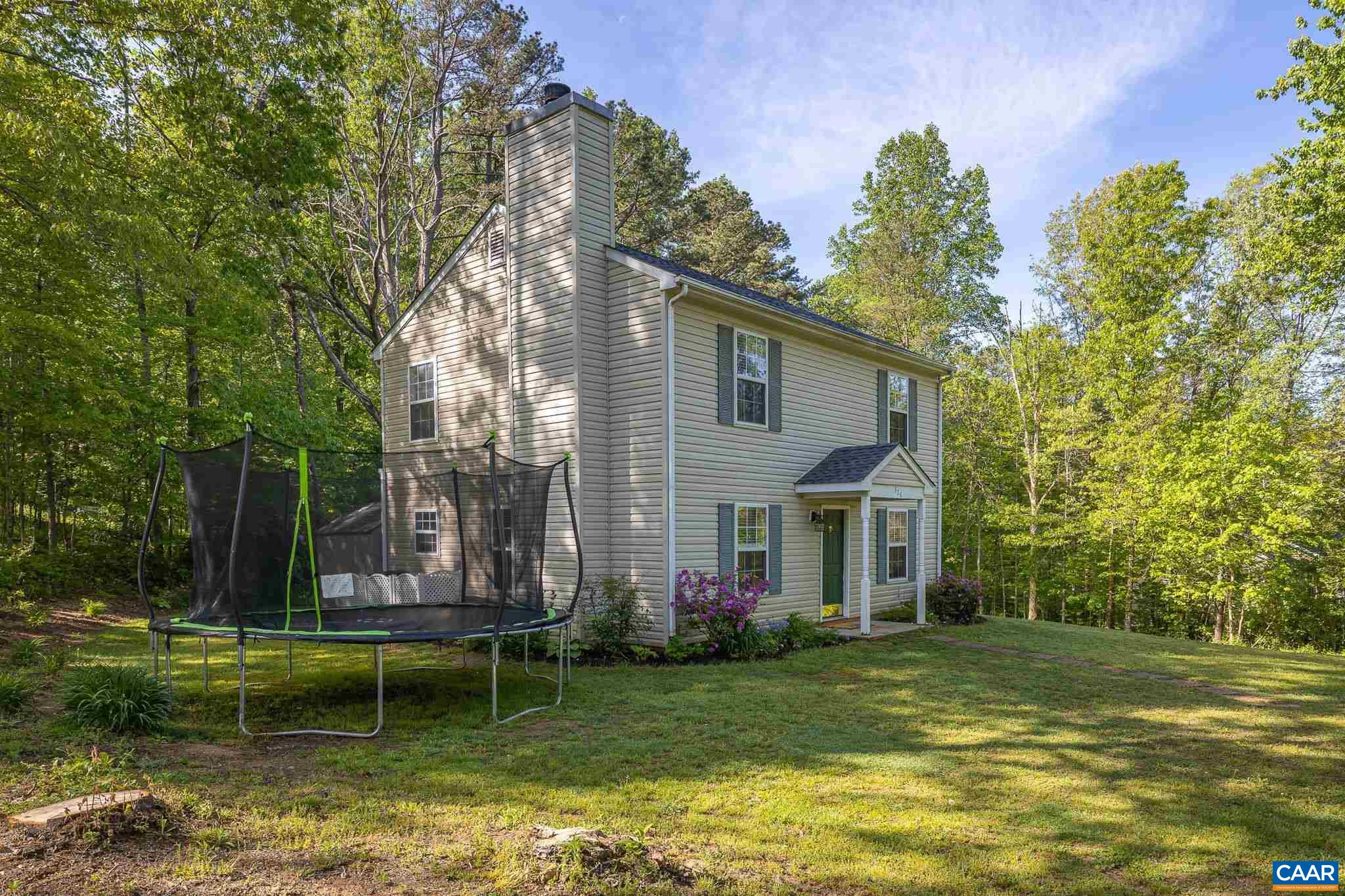 326 Geranium Road Ruckersville, VA 22968 - Photo 3 of 48 a view of a house with a yard in a lake
