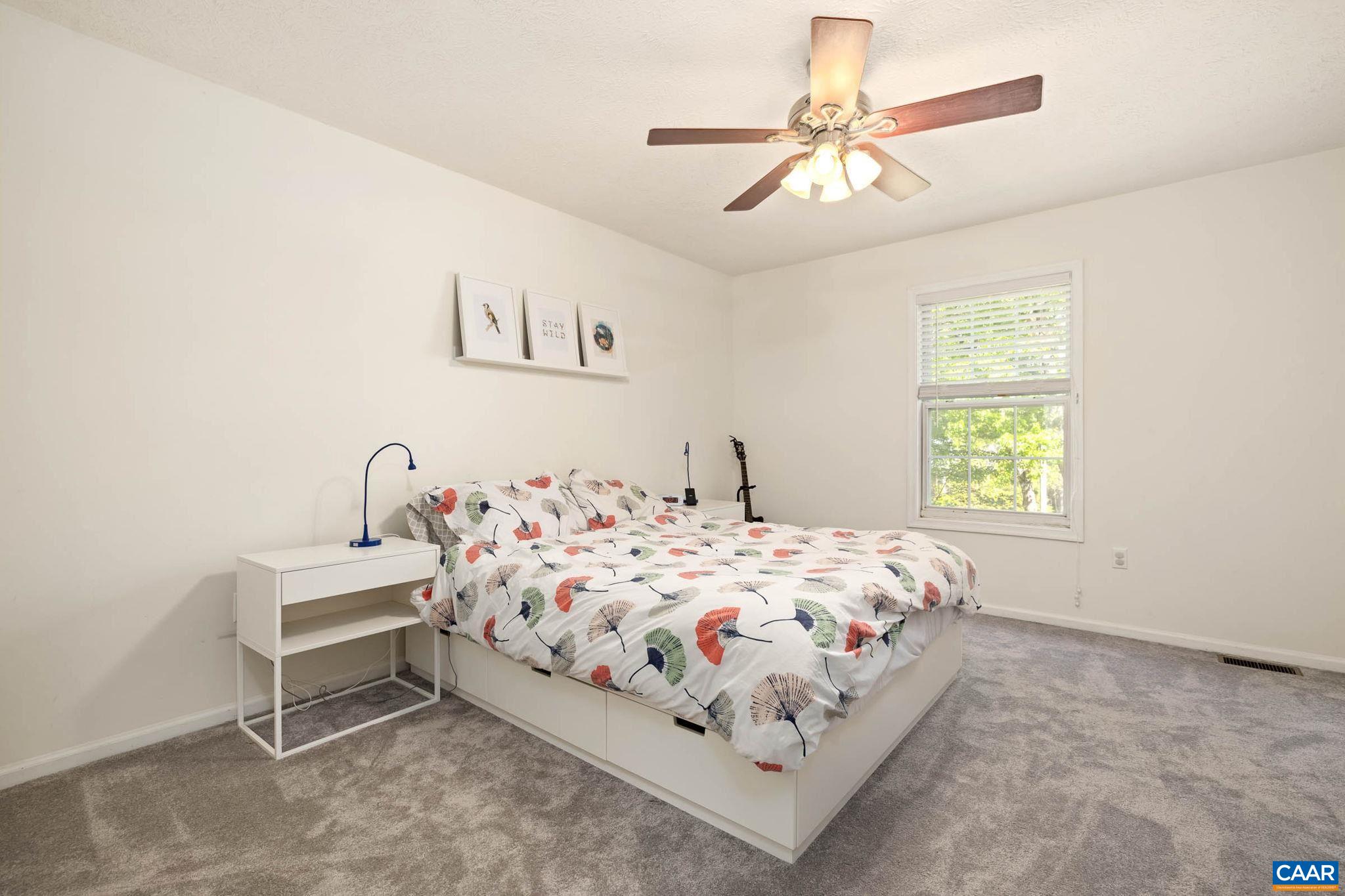 326 Geranium Road Ruckersville, VA 22968 - Photo 32 of 48 a bedroom with a bed and a window