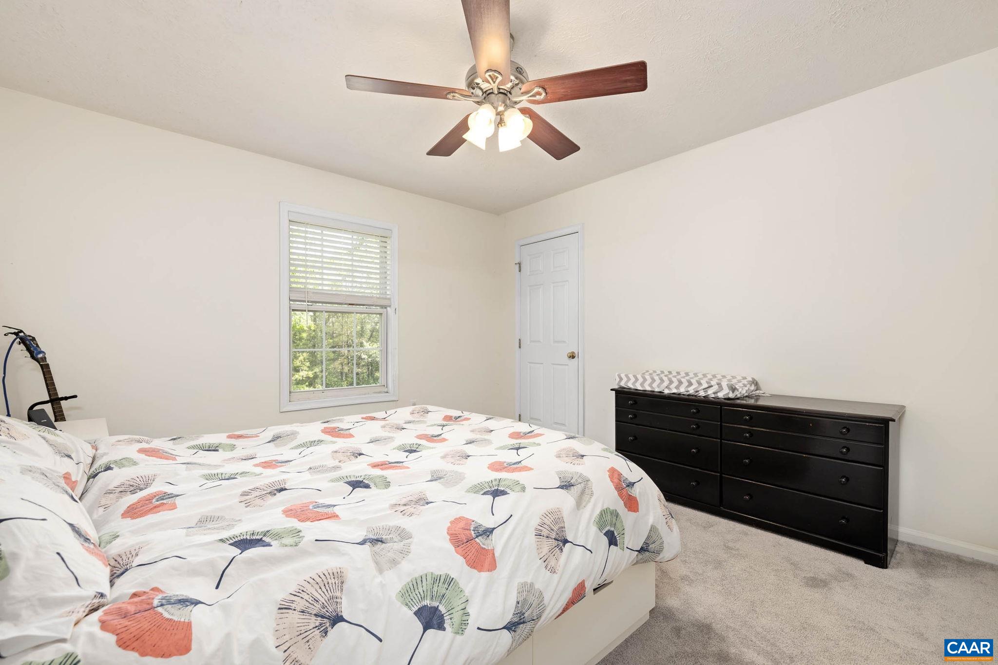 326 Geranium Road Ruckersville, VA 22968 - Photo 33 of 48 a bedroom with a bed and a dresser