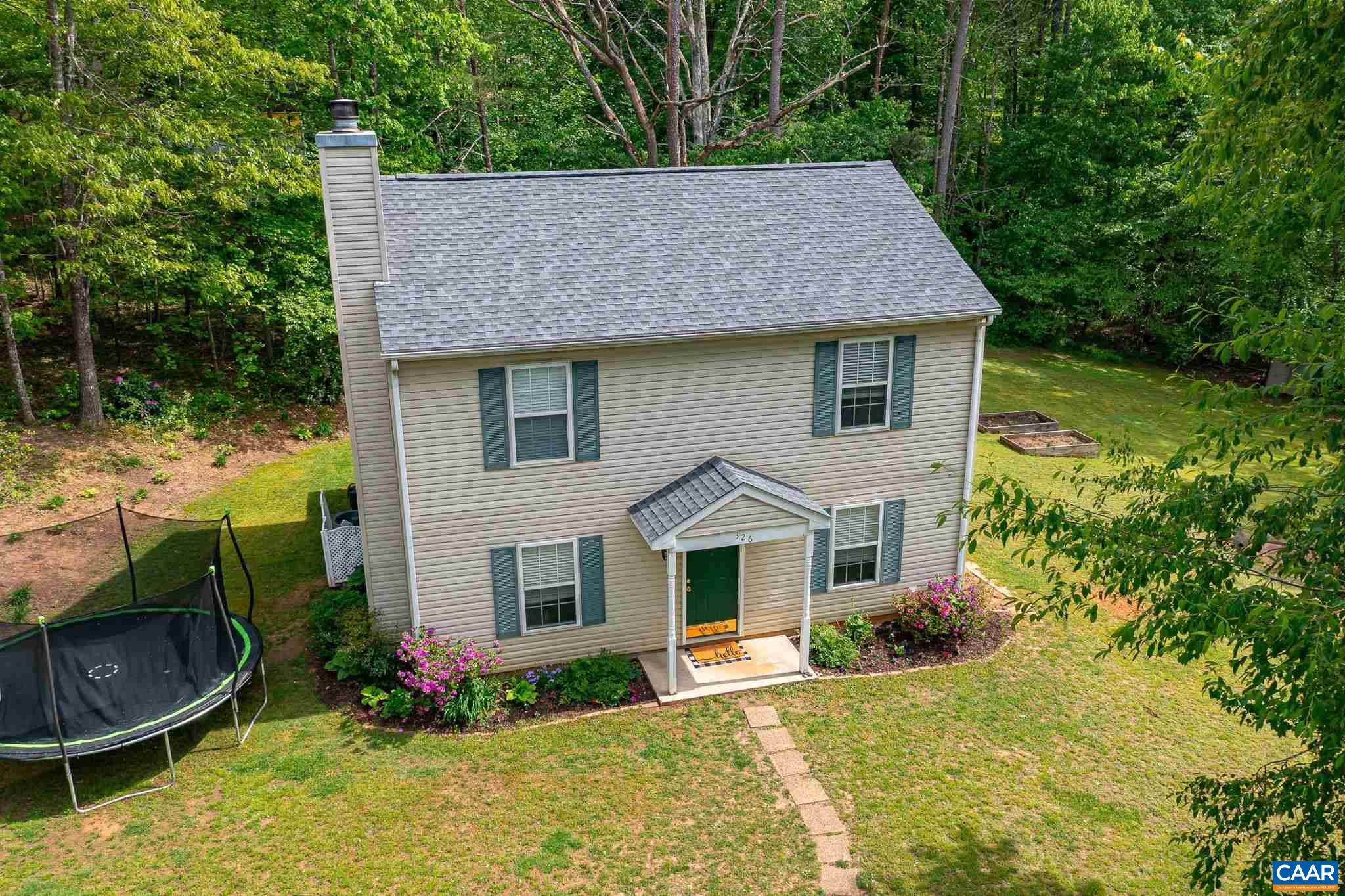 326 Geranium Road Ruckersville, VA 22968 - Photo 38 of 48 a front view of a house with garden