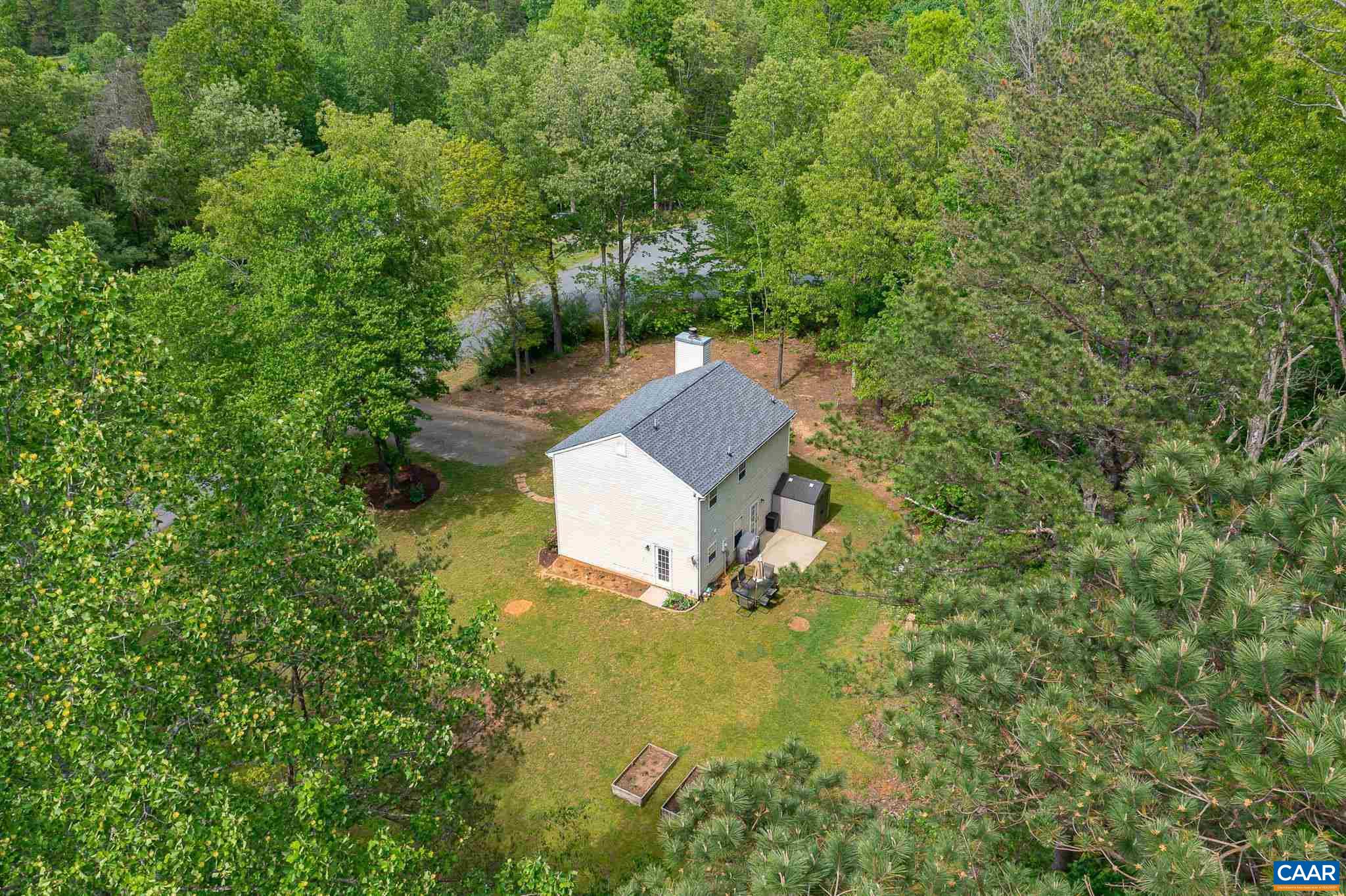 326 Geranium Road Ruckersville, VA 22968 - Photo 39 of 48 a view of a house with a yard