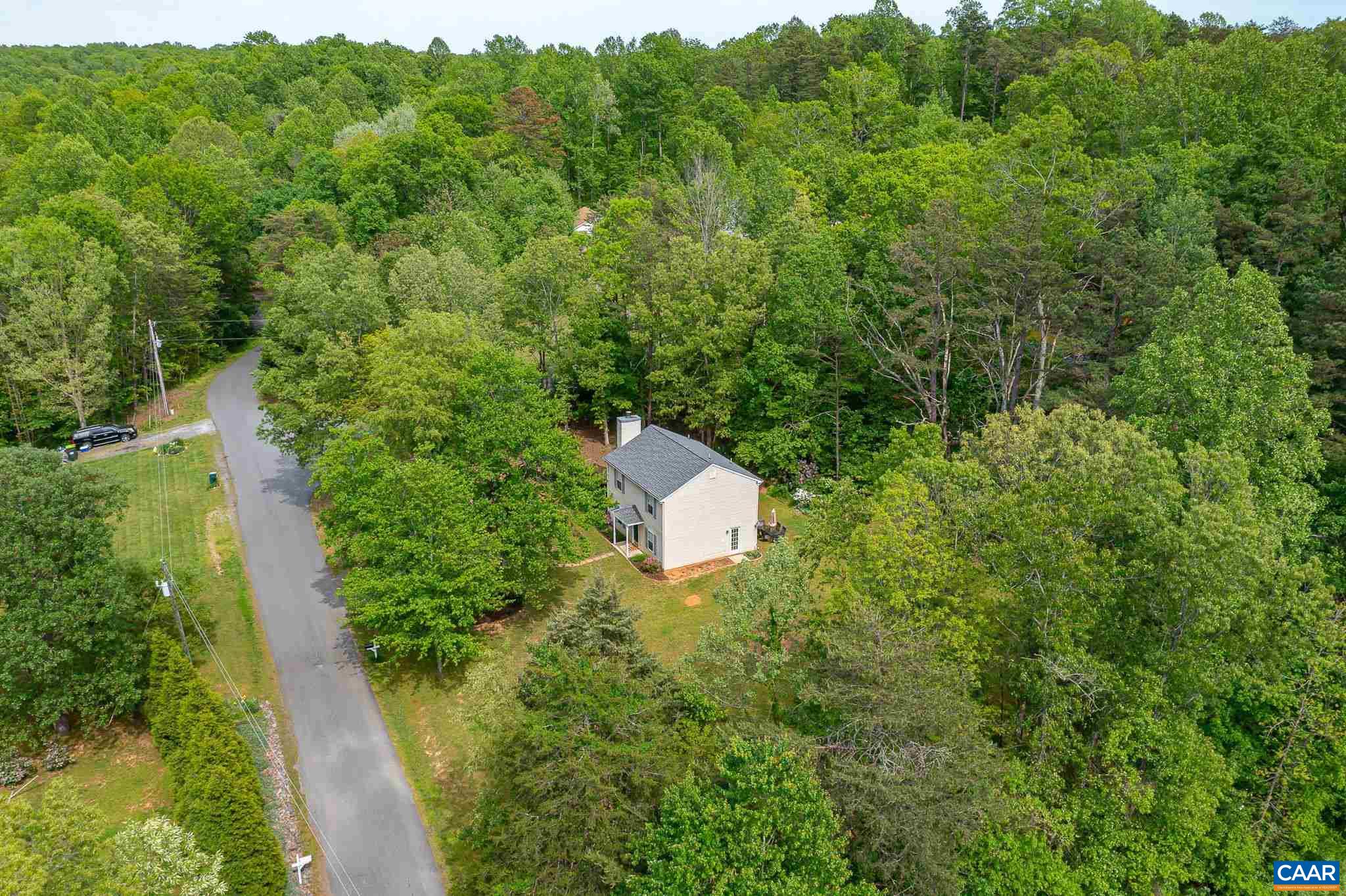 326 Geranium Road Ruckersville, VA 22968 - Photo 41 of 48 an aerial view of a house with a yard and trees all around