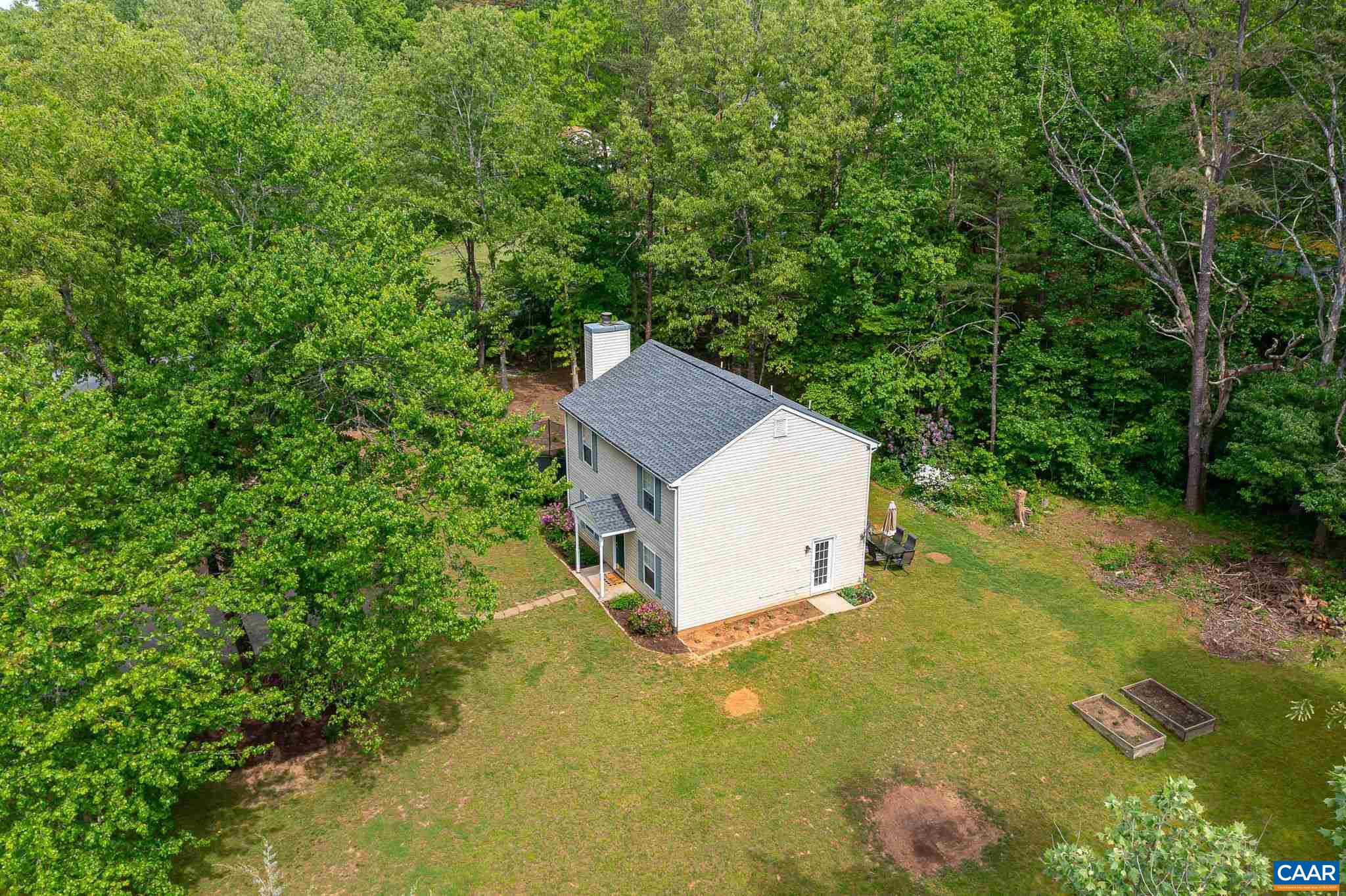 326 Geranium Road Ruckersville, VA 22968 - Photo 42 of 48 a house view with a backyard space