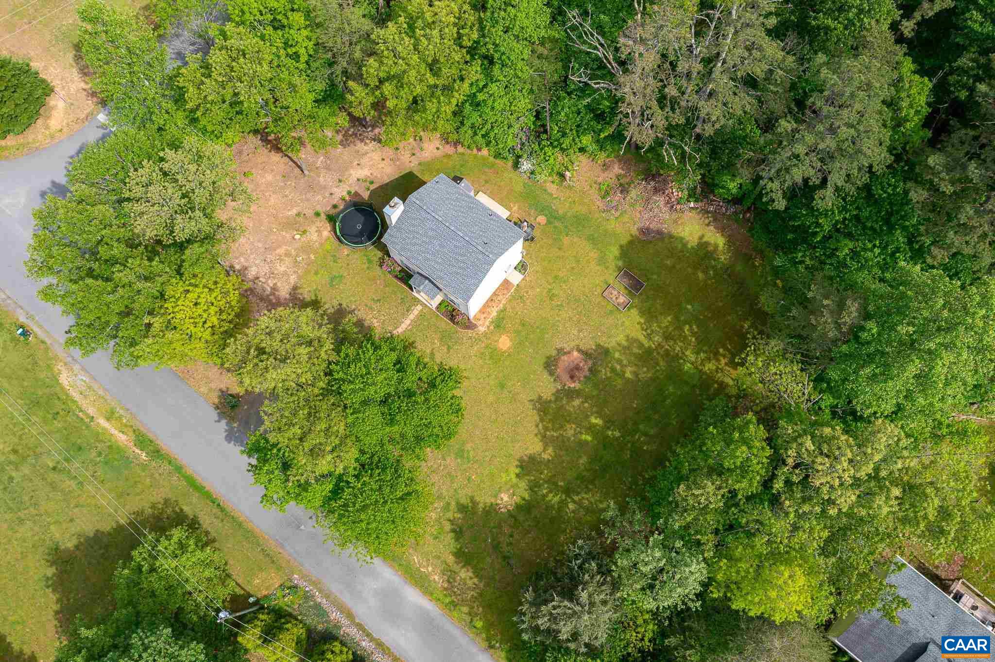 326 Geranium Road Ruckersville, VA 22968 - Photo 44 of 48 an aerial view of residential house with outdoor space and trees all around