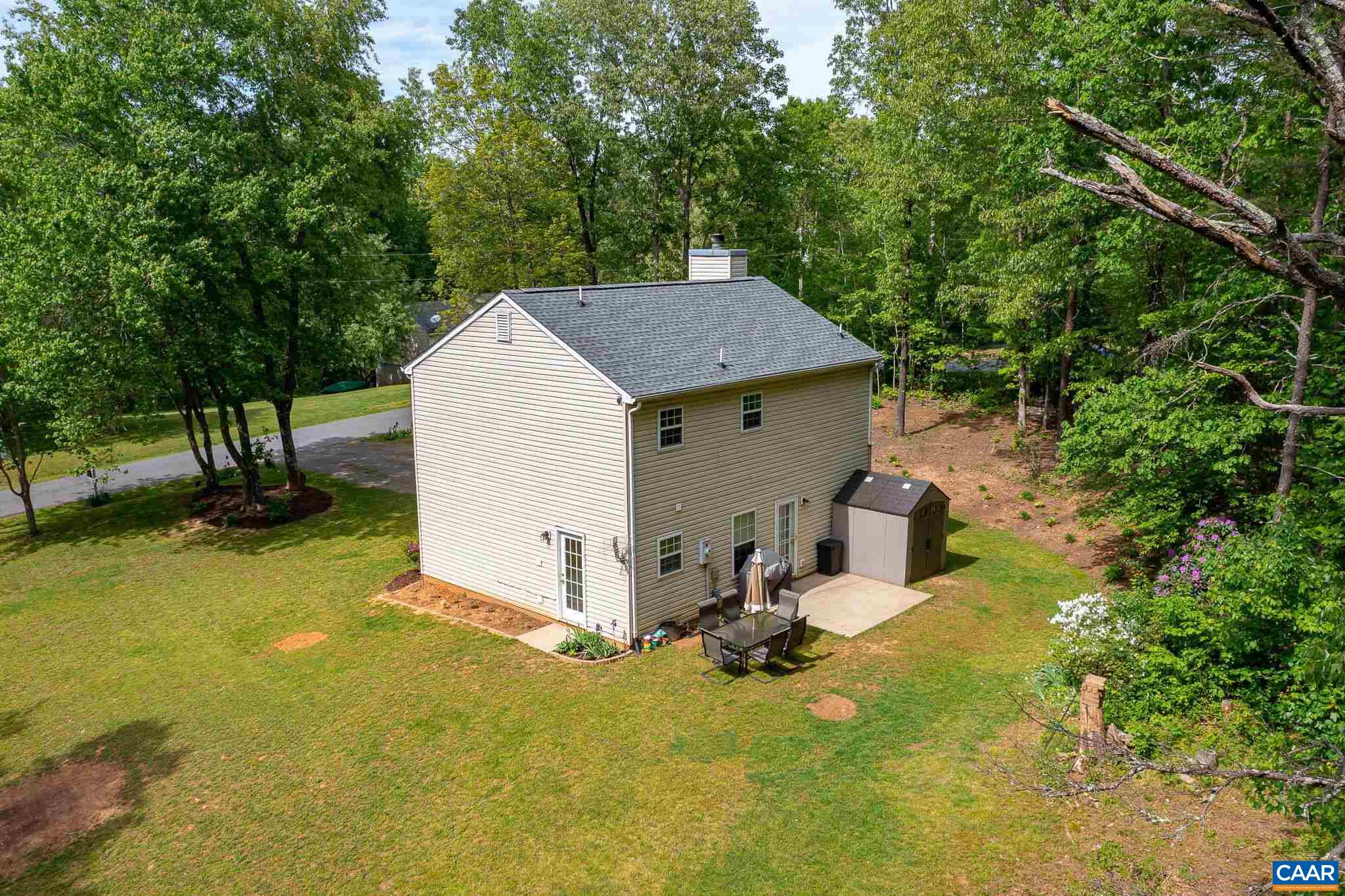 326 Geranium Road Ruckersville, VA 22968 - Photo 47 of 48 a view of a house with a yard and tree s
